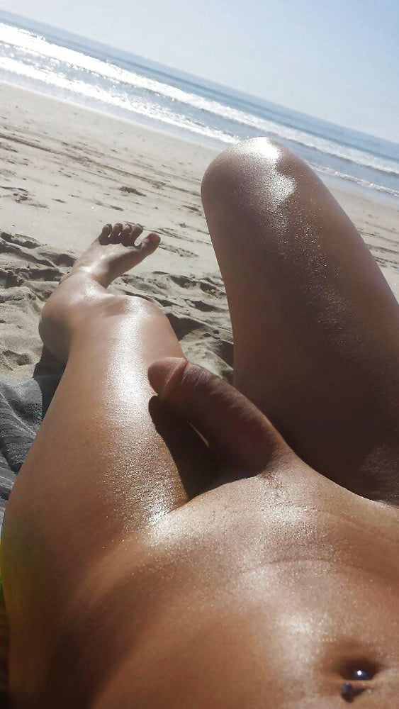 Ebony shaved handjob cock on beach