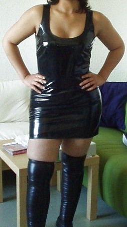 My wife in black vinyl dress and thigh high boots