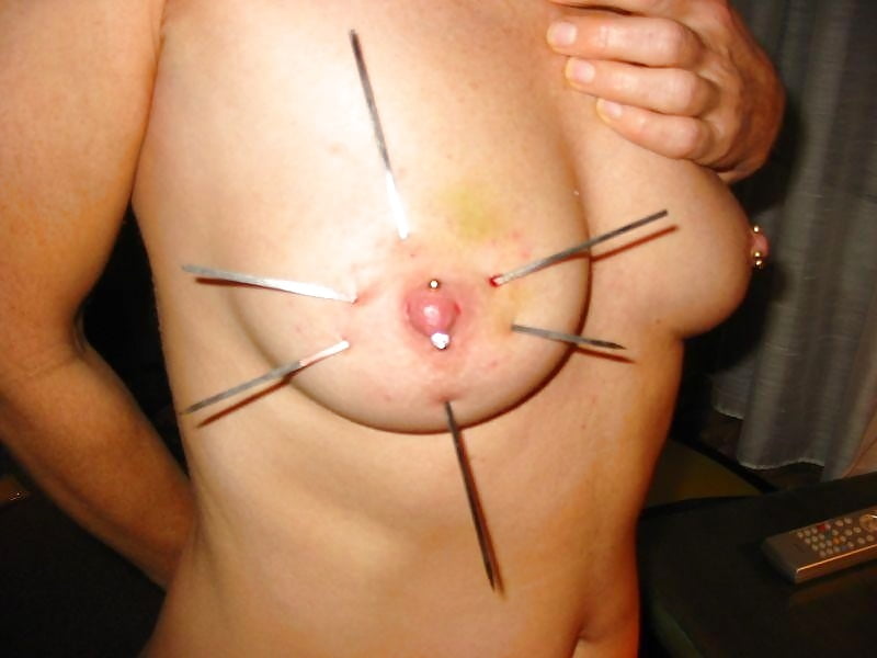 Female breast skewer torture
