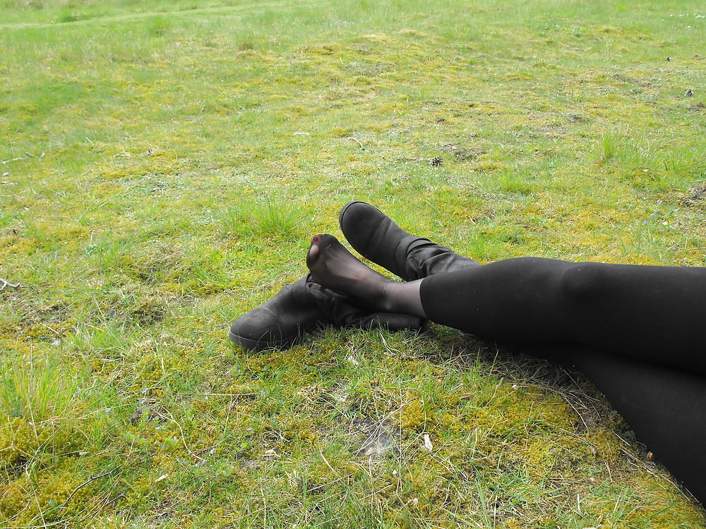 Em showing her sexy feet in the forest in black tights pict gal