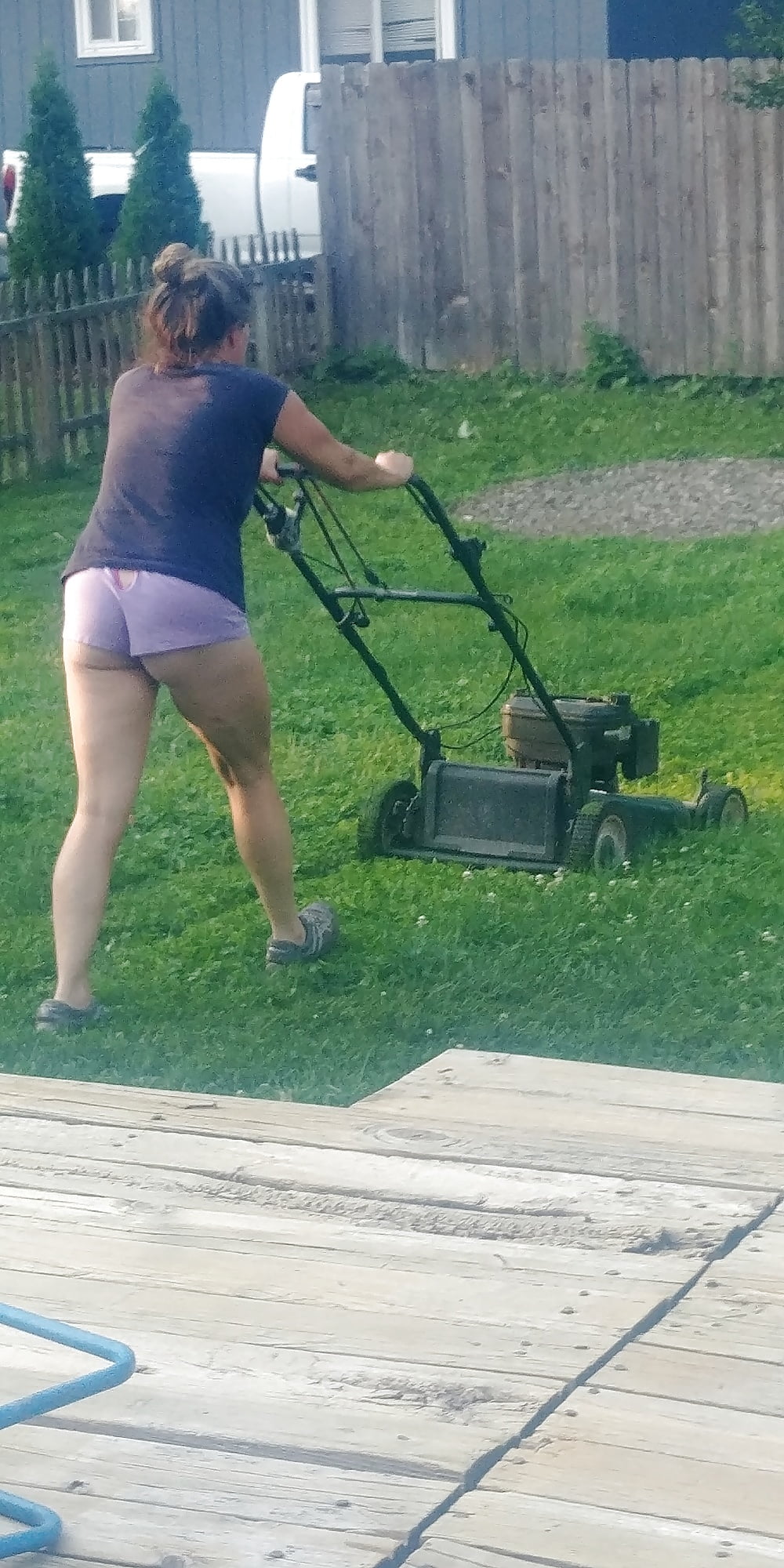 Wife Mowing Lawn And Treati