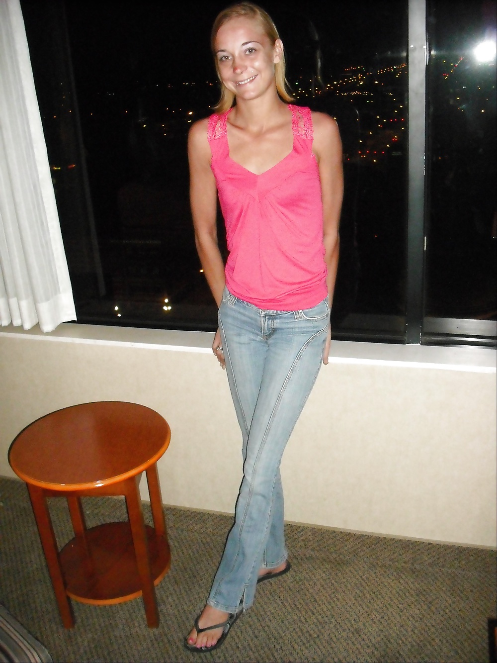 Skinny Hooker flashes in a hotel window pict gal