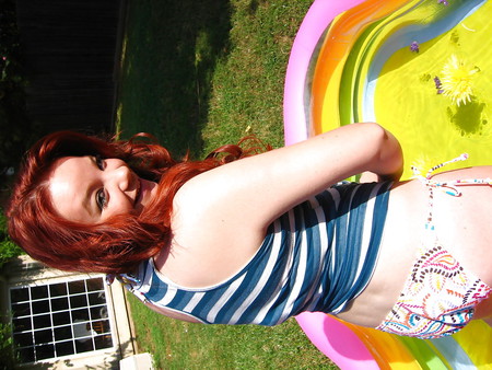 Sizzling Hot Busty Redhead in Bikini Pool