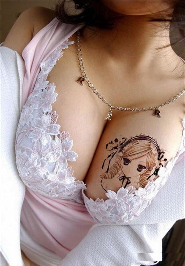 Cross tattoos between breast