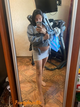 pregnant brunette in sheer pantyhose         