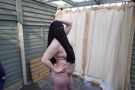nude in niqab in ankle boots         