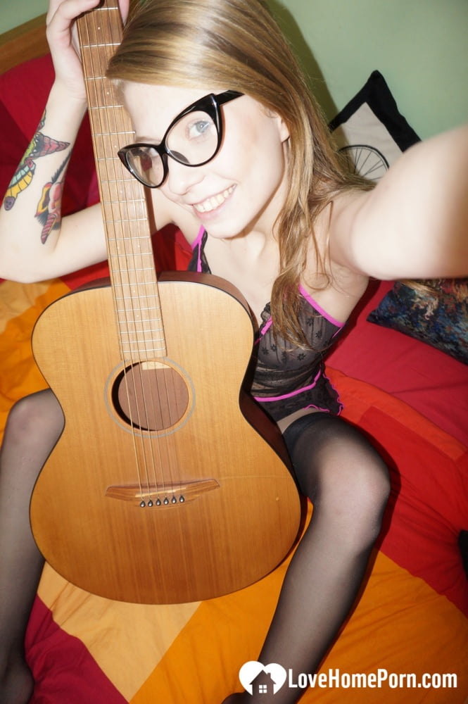 Cute nerdy guitarist posing in some lingerie - 15 Photos 