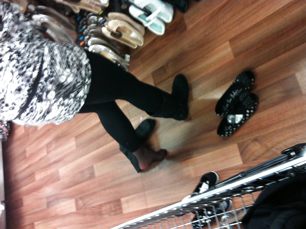 Em trying on shoes in asda, black tights pict gal