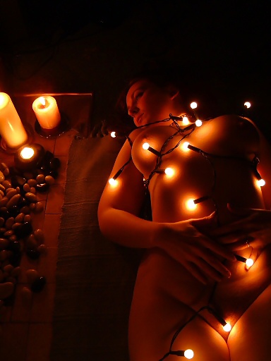 Busty Redhead Plays with Christmas Lights pict gal