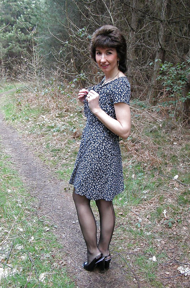 Amateur mature lady takes a walk in the woods. pict gal
